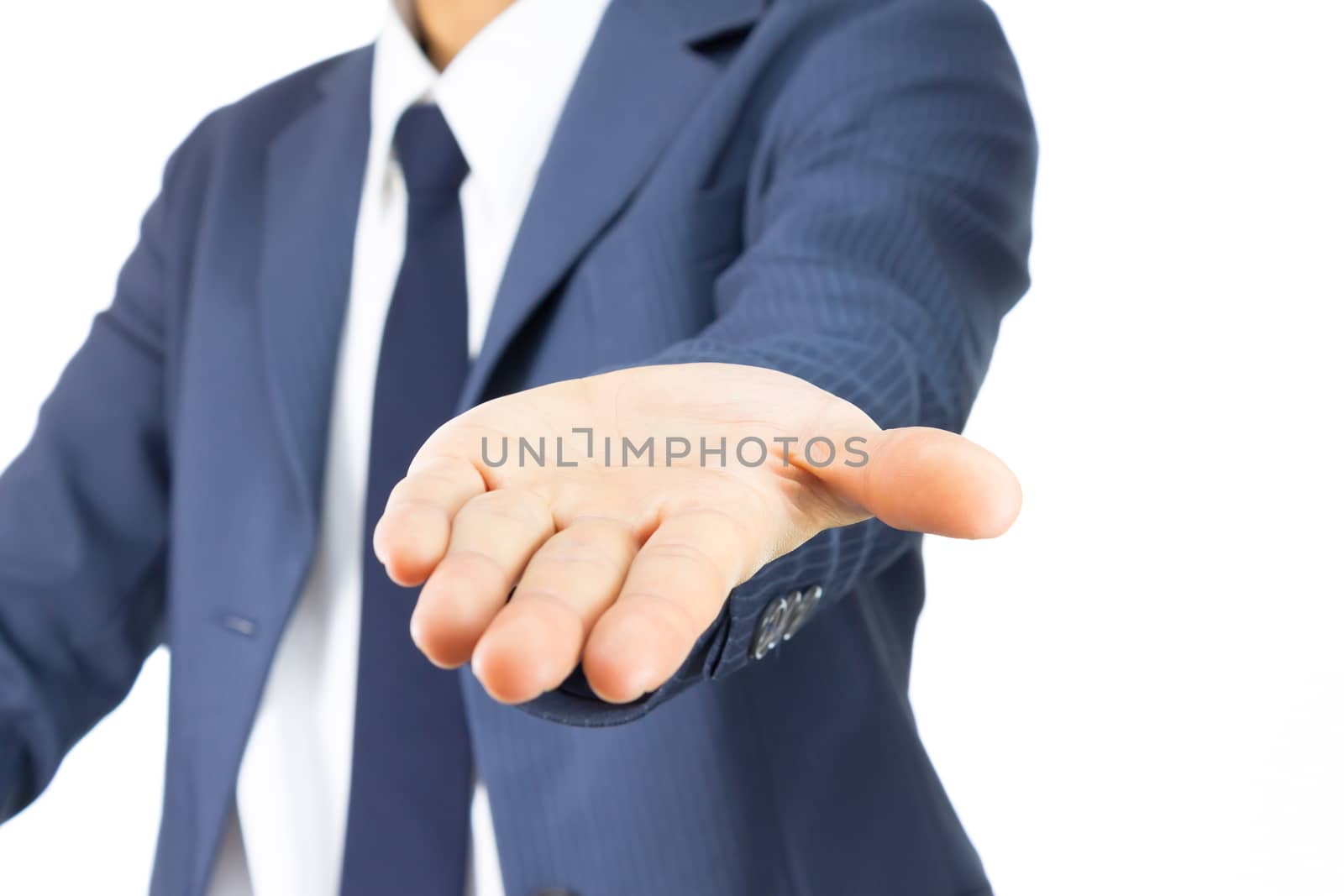 Opening Palm Hand of Businessman in Blue Suit Isolated on White Background. Concept about Giving or Seek.