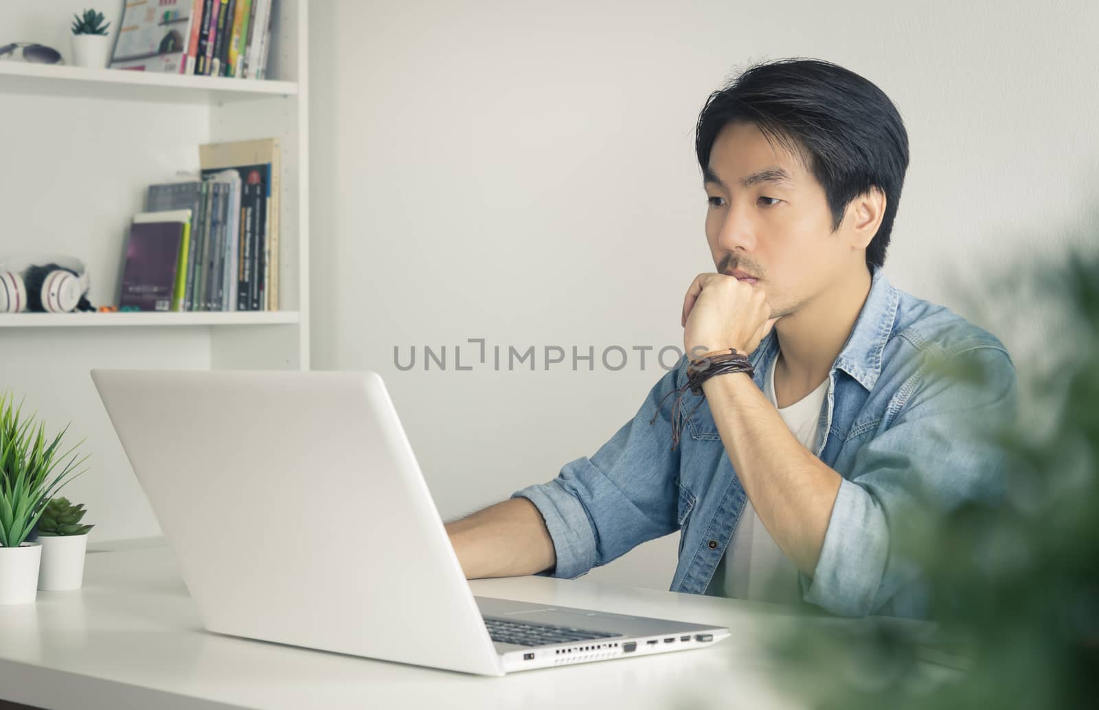 Portrait Asian Casual Businessman Use Laptop and Thinking and Se by steafpong