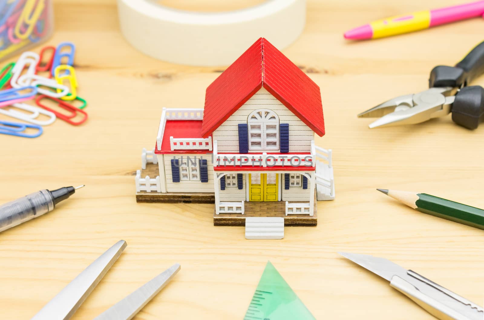 Home Improvement Concept. Home improvement background including Scissors Pen Paper Clip Sticky tape Pliers Pencil Cutter Water Level