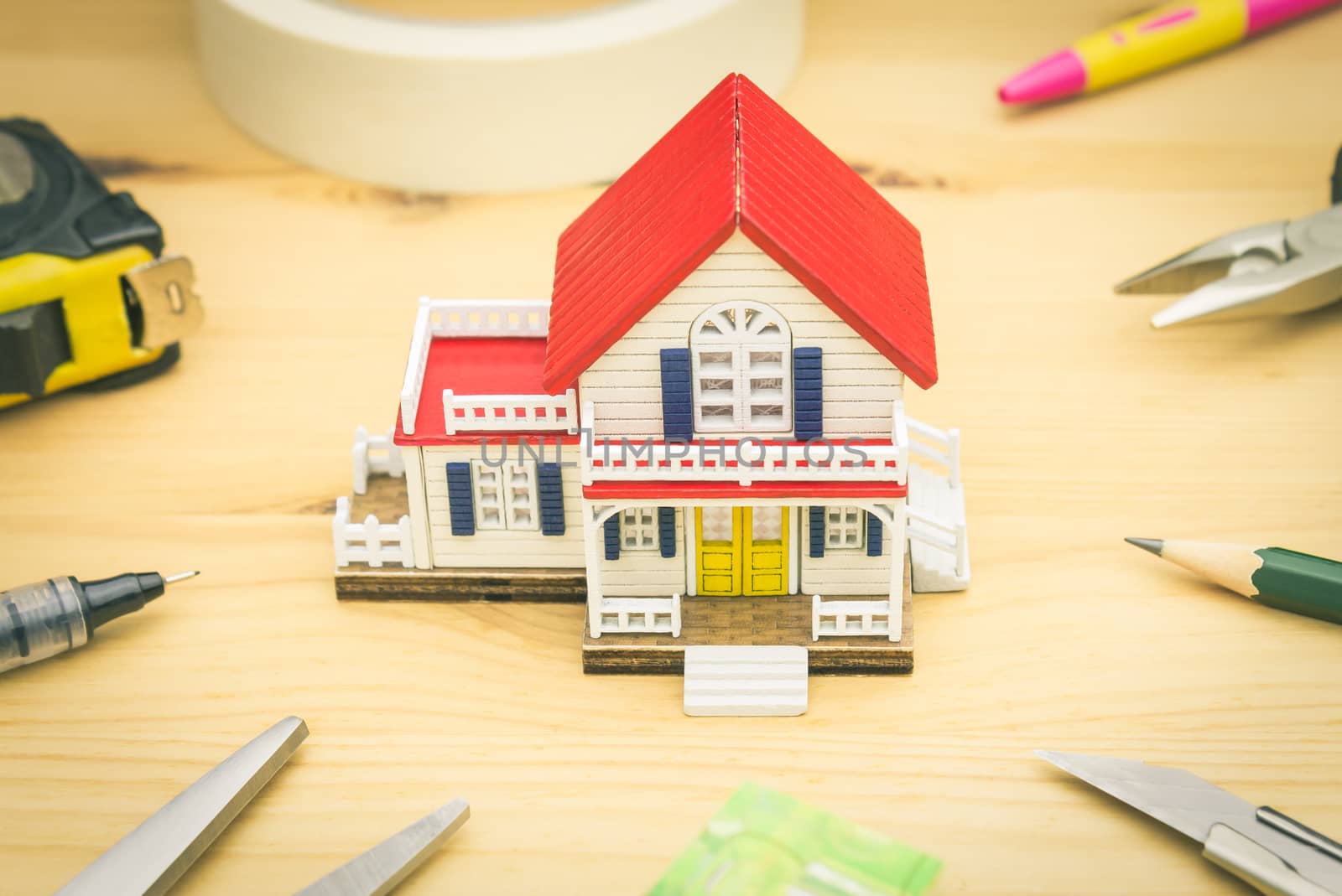 Home Improvement Concept. Home improvement background including Scissors Pen Measuring Tape Sticky tape Pliers Pencil Cutter Water Level