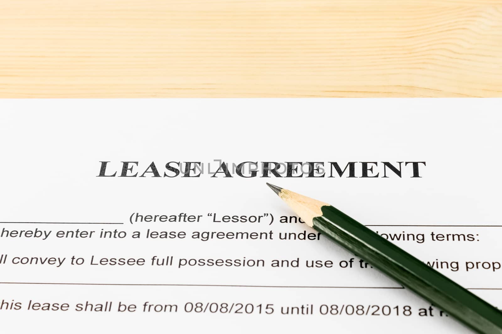 Lease Agreement Contract Document and Pencil Horizontal View on Wood Table in Vintage Style. Legal document for business event