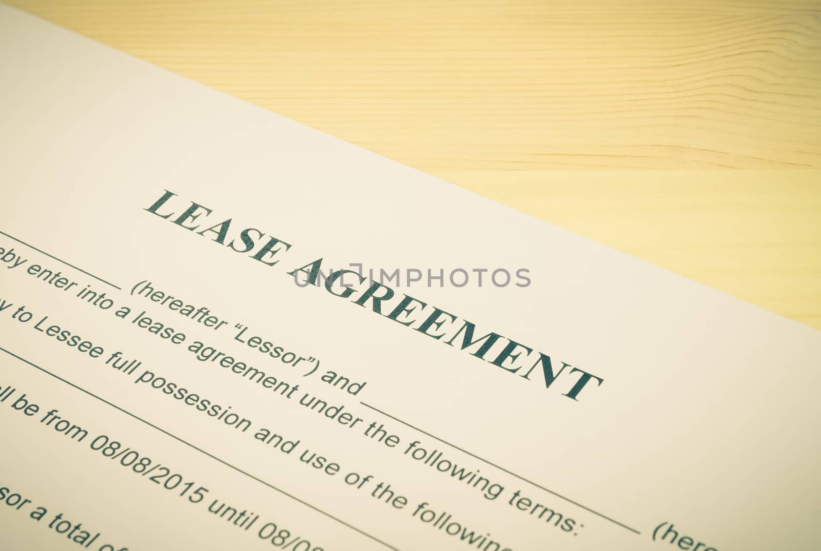 Lease Agreement Contract Document Left Angle View on Wood Table in Vintage Style. Legal document for business event