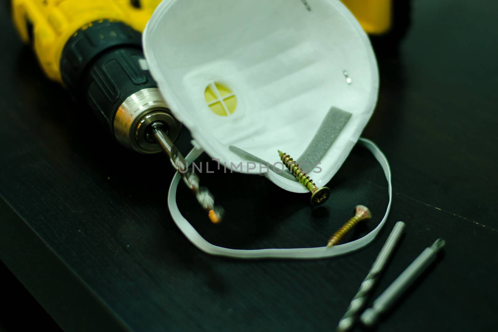 drill, respirator and screws on the table by jk3030