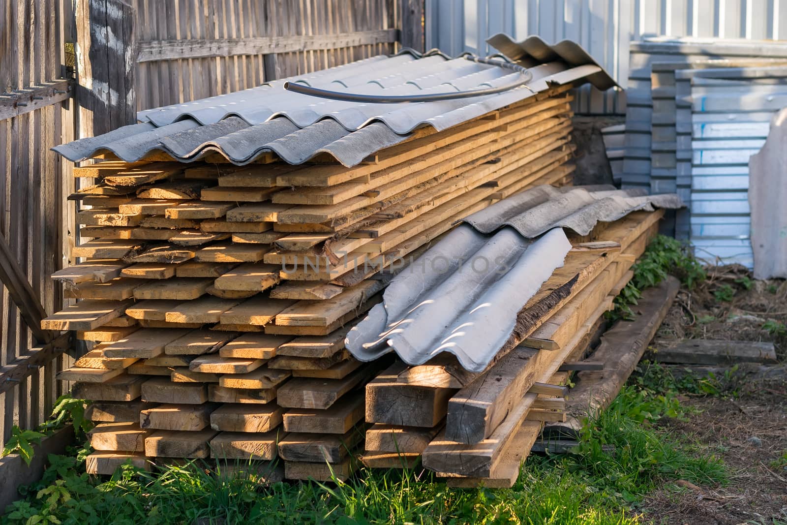 Boards, lumber, stored and covered with slate by jk3030