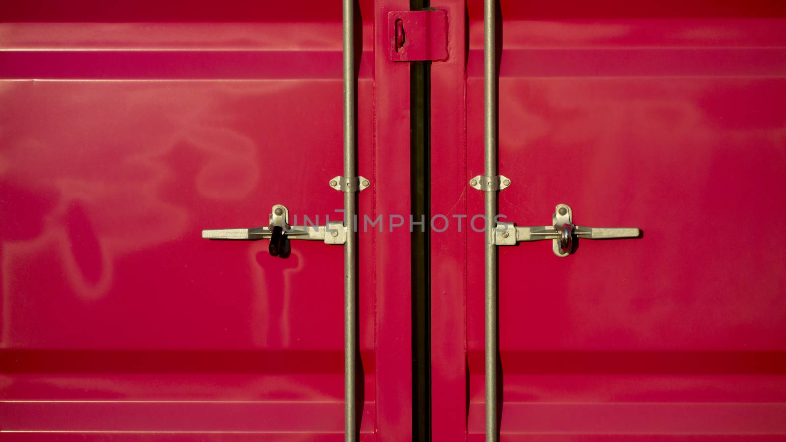 door face of metal cargo container. Pink Container door lock. Cargo pink container for transportation with closed door.  