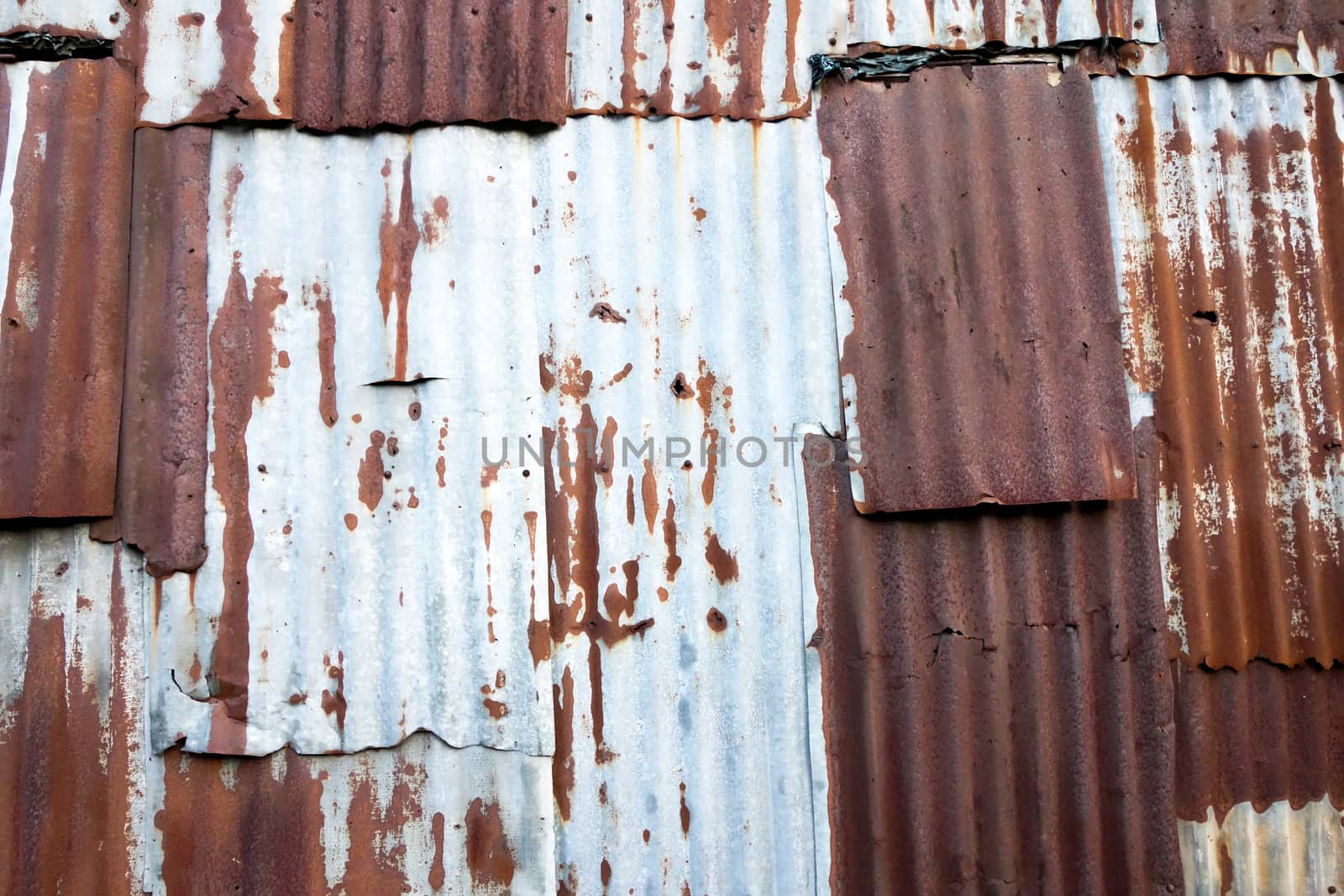 Old rusty zinc plat wall, Zinc wall ,rusty Zinc grunge background. process in vintage style