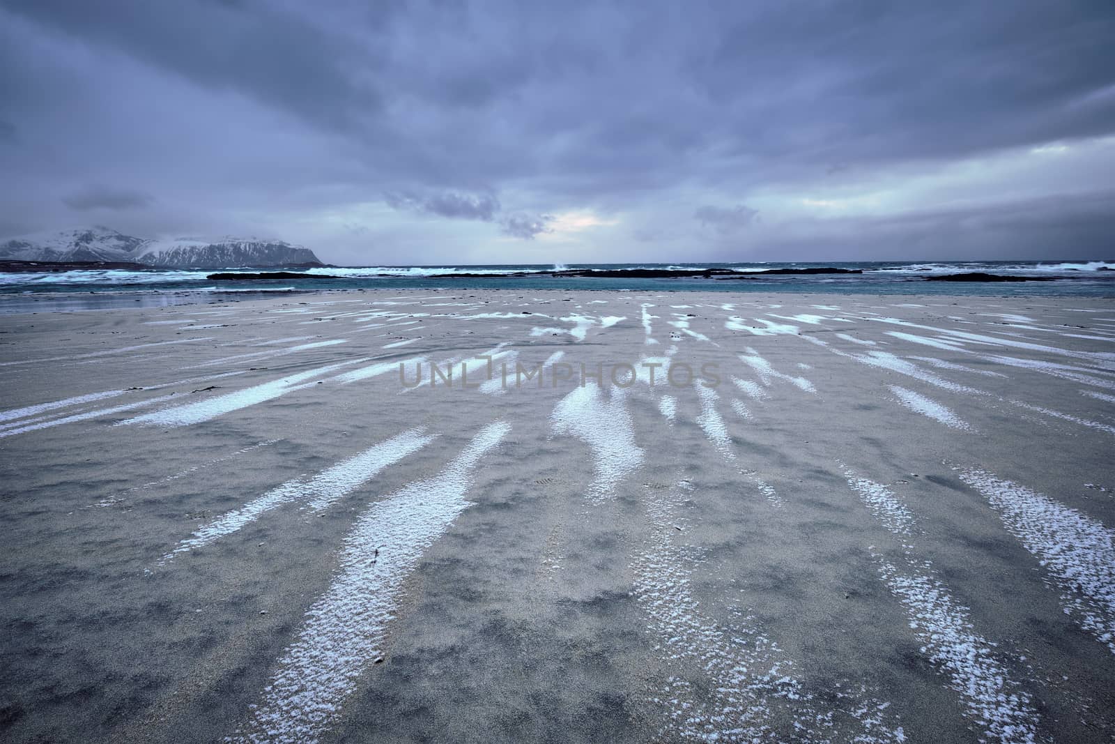 Rocky coast of fjord of Norwegian sea in winter. Skagsanden beach, Lofoten islands, Norway