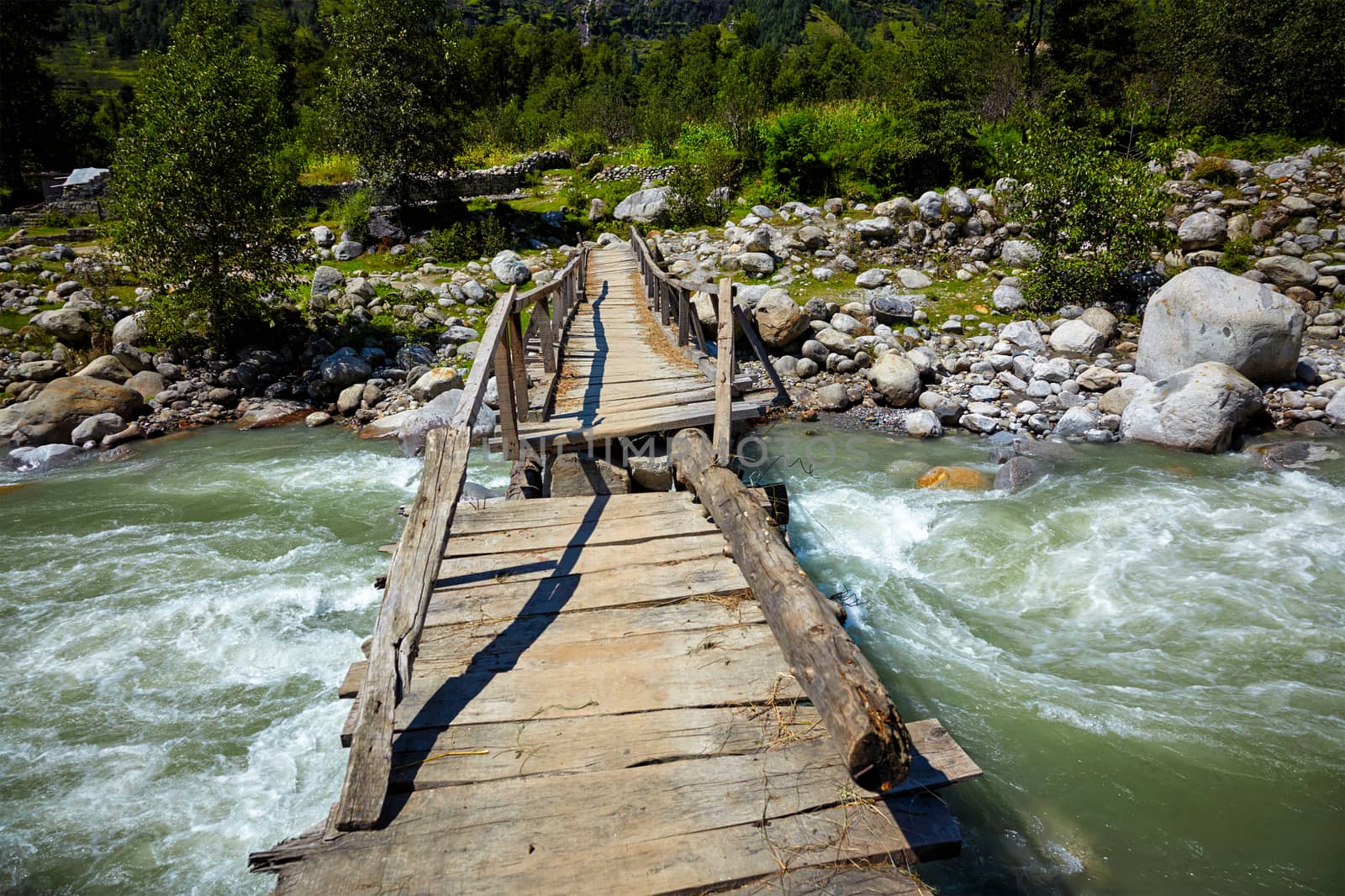 Bridge over river in Himalayas by dimol