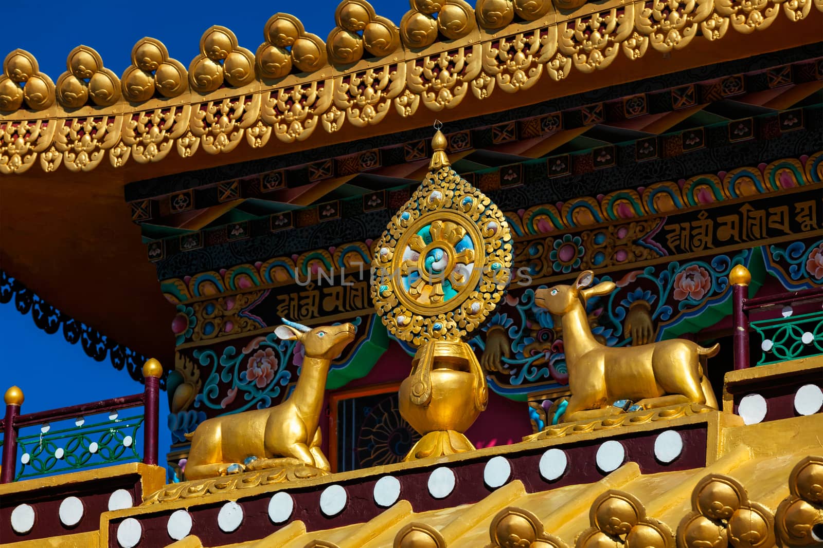 Buddhist Wheel of the Law on monastery, India by dimol