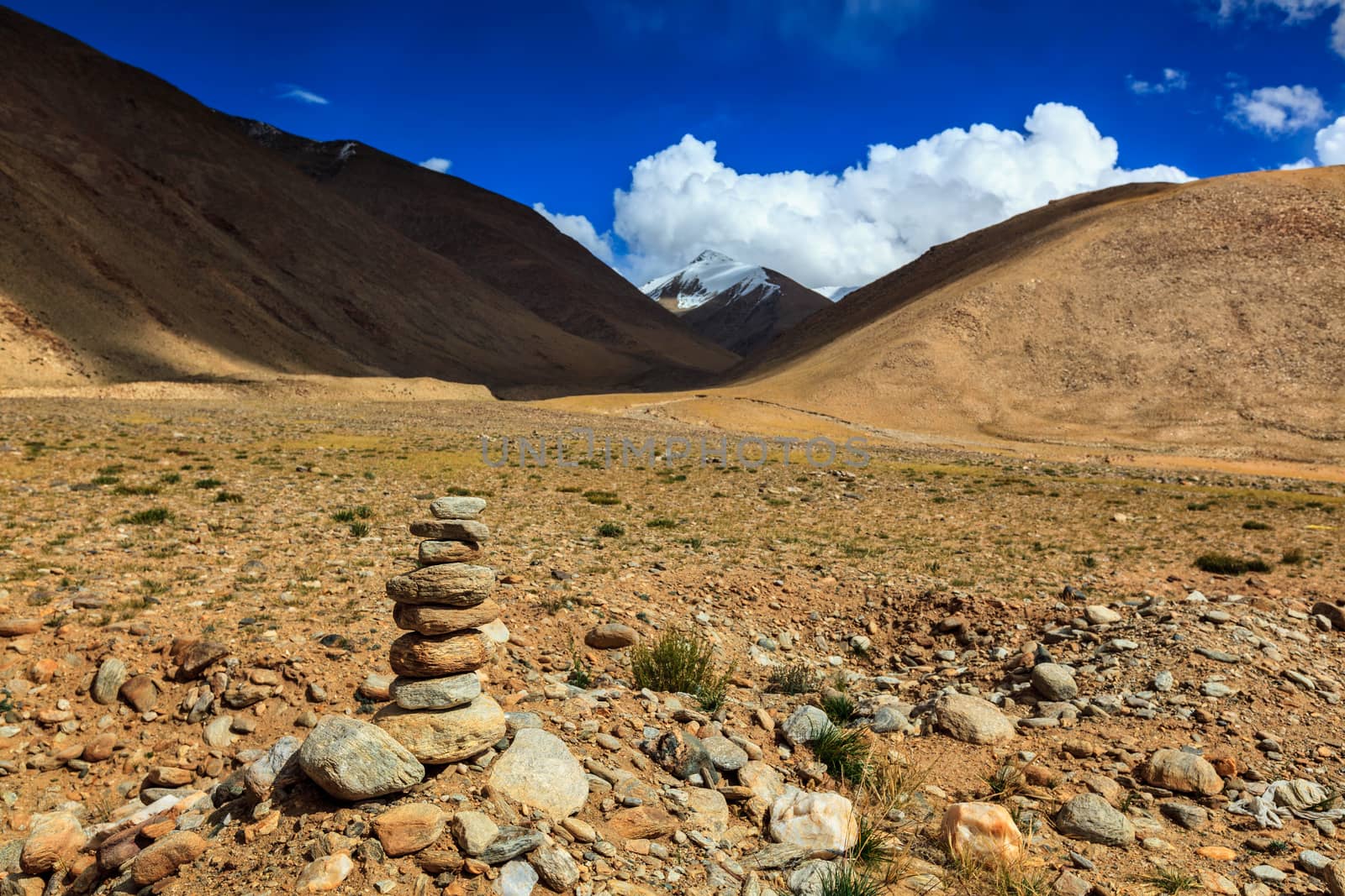 Stone cairn in Himalayas by dimol