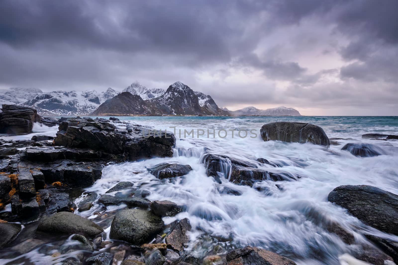 Rocky coast of fjord of Norwegian sea in winter. Vareid, Lofoten islands, Norway