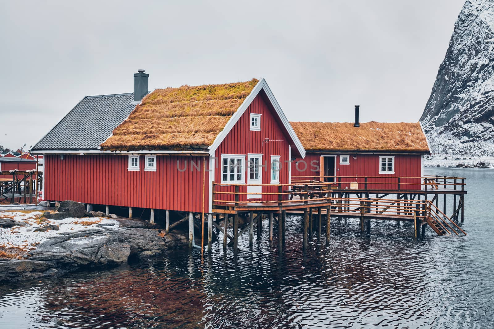 Traditional red rorbu house in Reine village on Lofoten Islands, by dimol