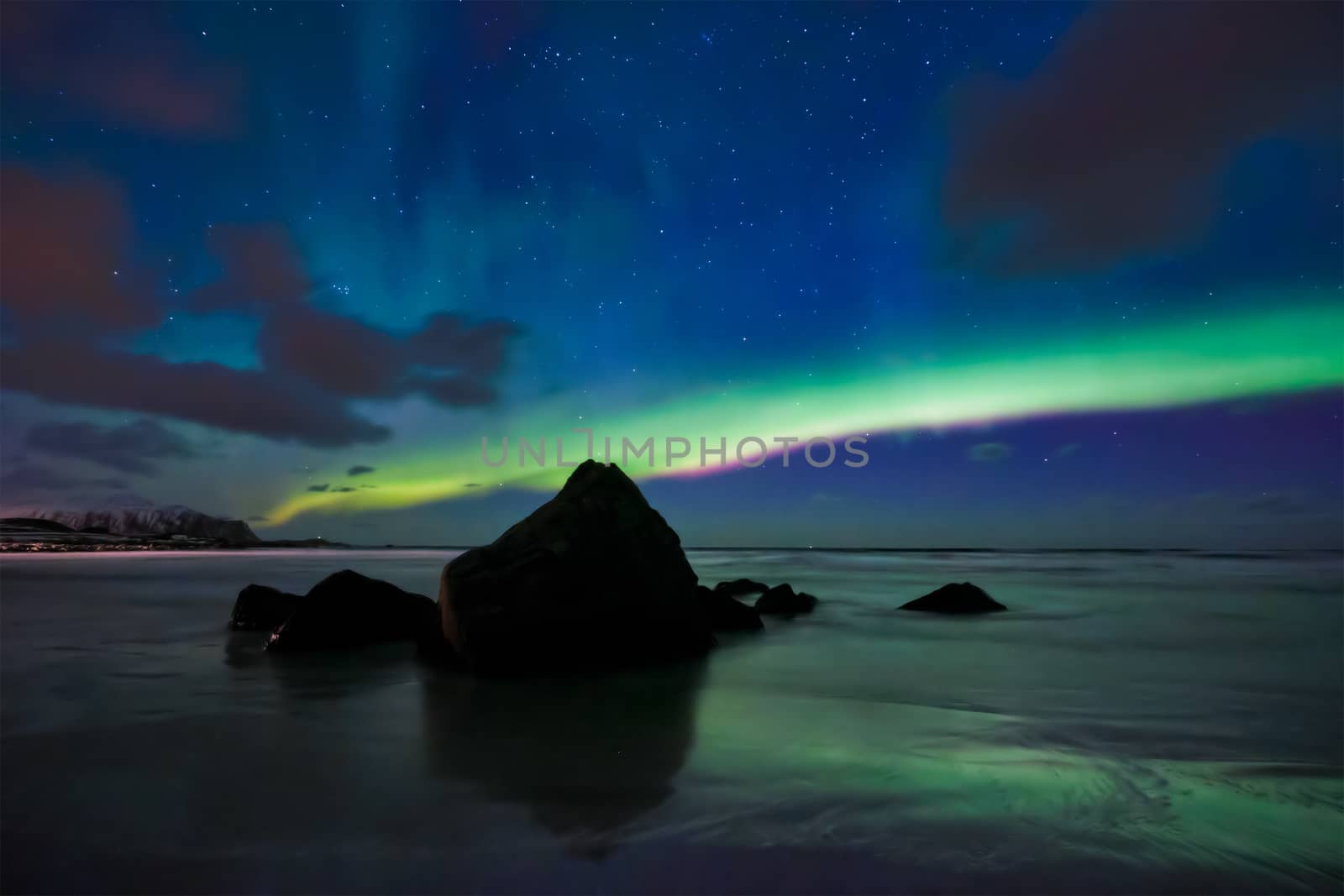 Aurora borealis northern lights on Skagsanden beach. Lofoten Islands, Norway