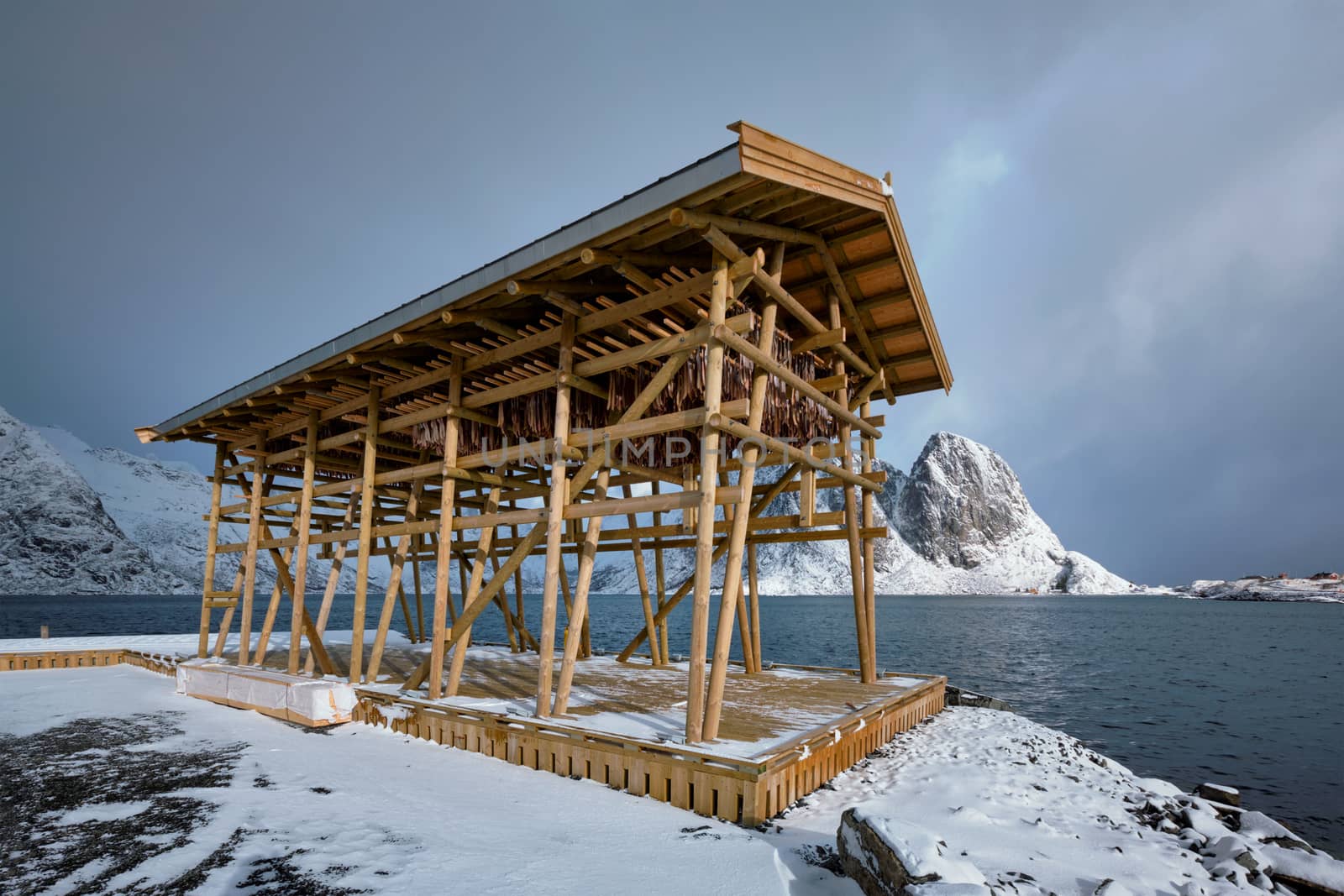 Drying flakes for stockfish cod fish in winter. Sakrisoy fishing village, Lofoten islands, Norway