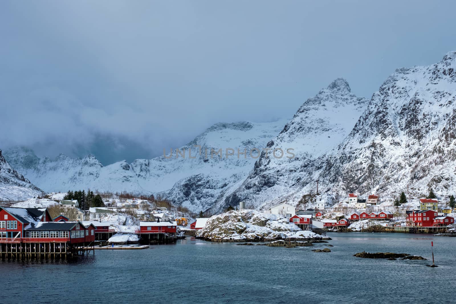 Traditional fishing village A on Lofoten Islands, Norway with red rorbu houses. With snow in winter