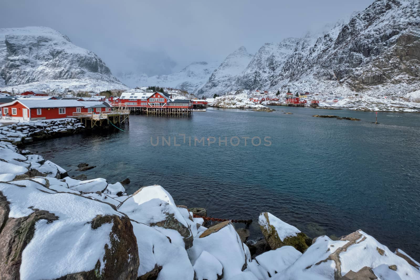 Traditional fishing village A on Lofoten Islands, Norway with red rorbu houses. With snow in winter