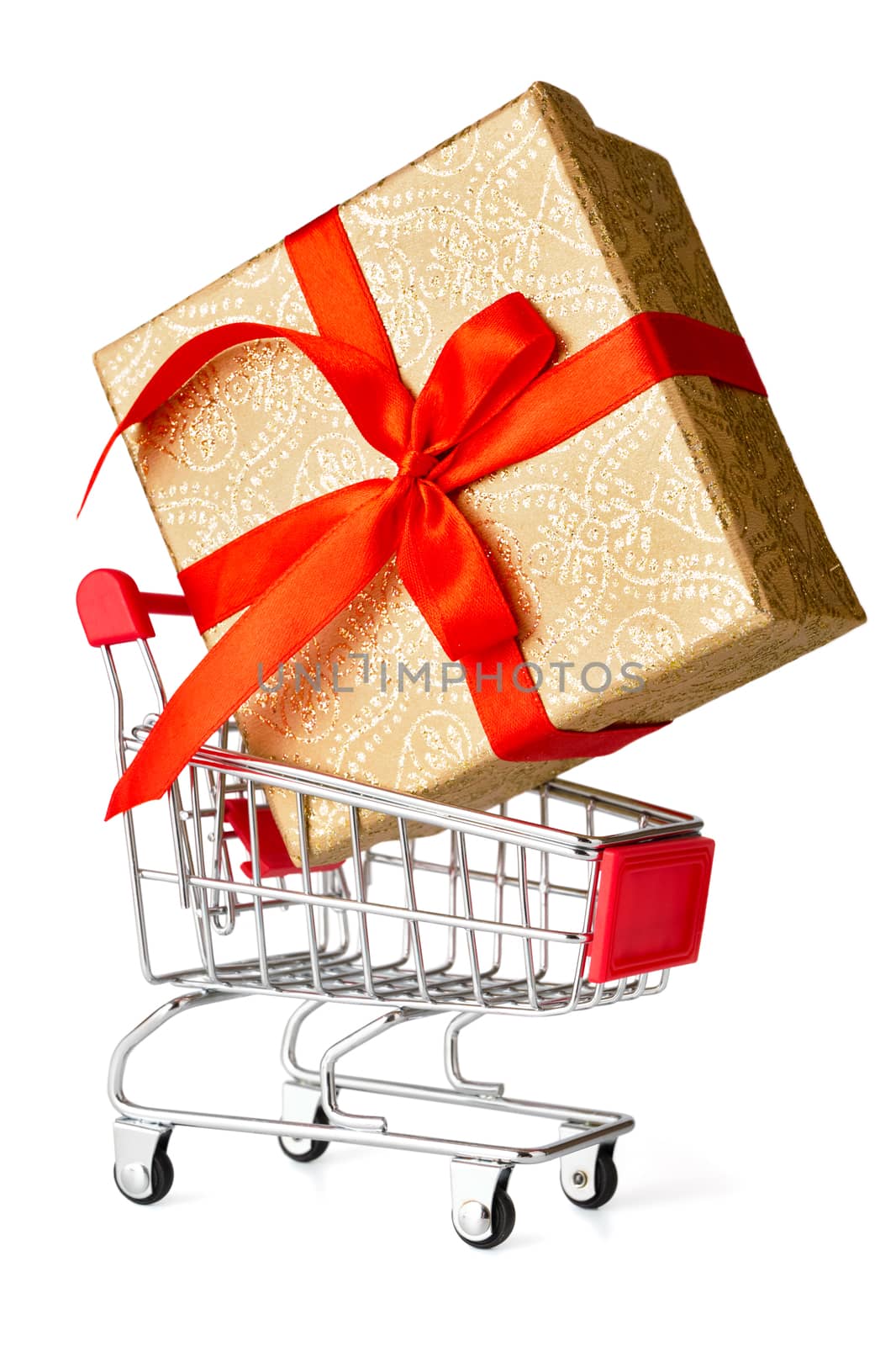 Gift shopping concept - gift box in shopping cart isolated on white