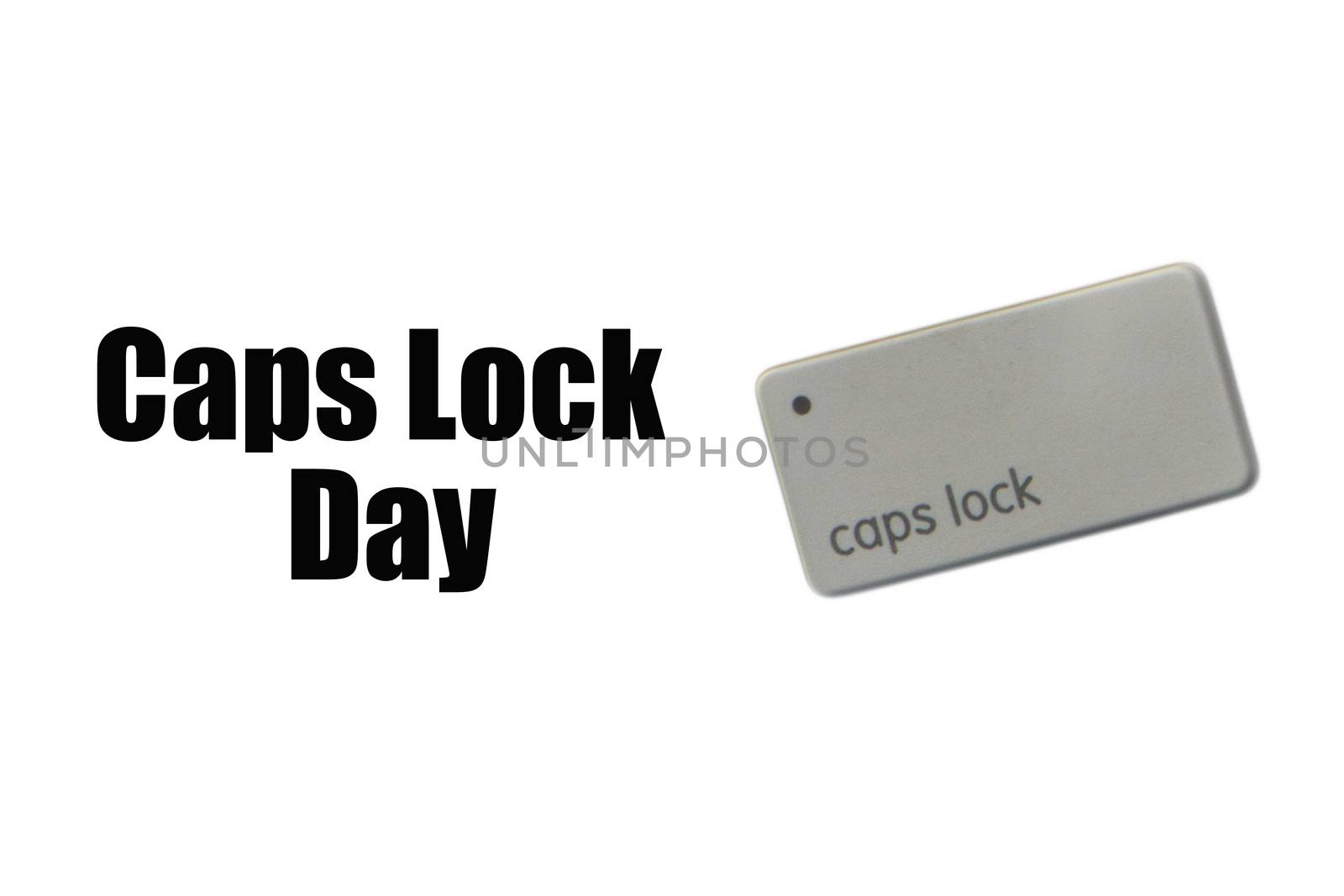 CAPS LOCK DAY text and computer keyboard on white background by silverwings