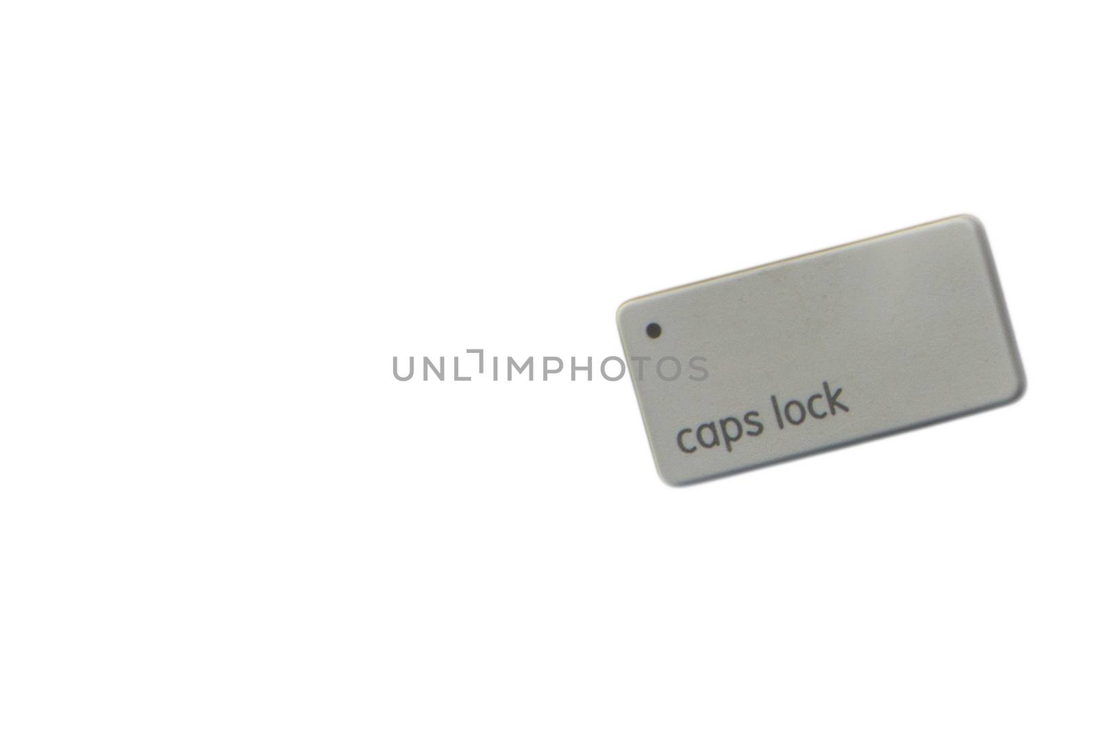 CAPS LOCK button computer keyboard on white background by silverwings