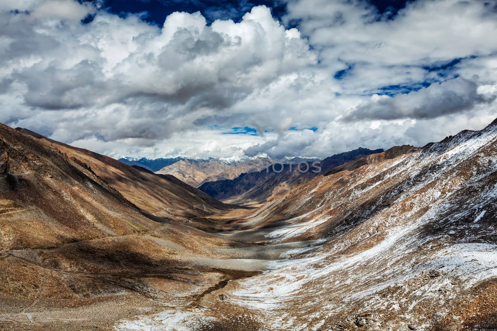 Valley and Karakorum Range on horizon. View from Khardung La pass - allegedly the highest motorable pass in the world (5602 m). Ladakh, India