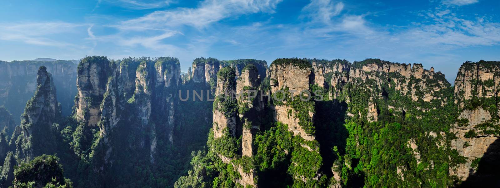 Panorama of famous tourist attraction of China Avatar mountains - Zhangjiajie stone pillars cliff mountains on sunset at Wulingyuan, Hunan, China