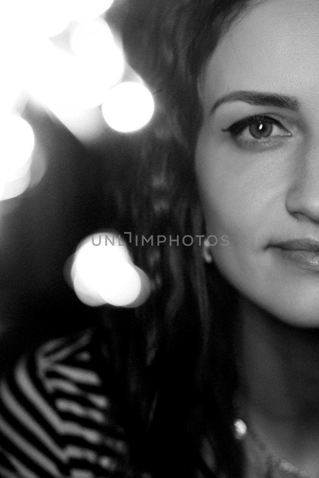 girl lit sparklers inside a wooden house late at night