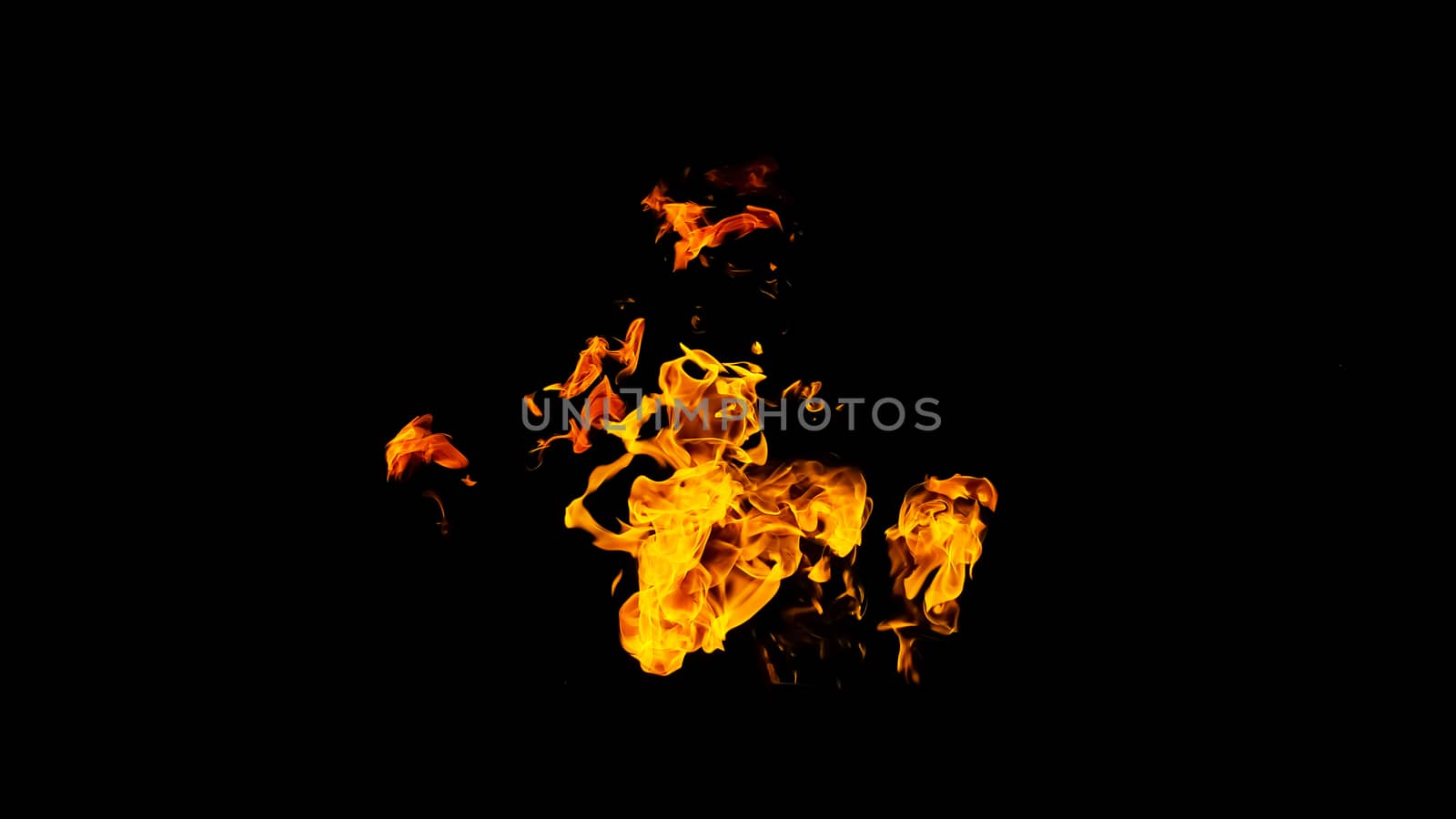 Fire flames on black background isolated. Burning gas or gasoline burns with fire and flames. Flaming burning sparks close-up, fire patterns. Infernal glow of fire in the dark with copy-space