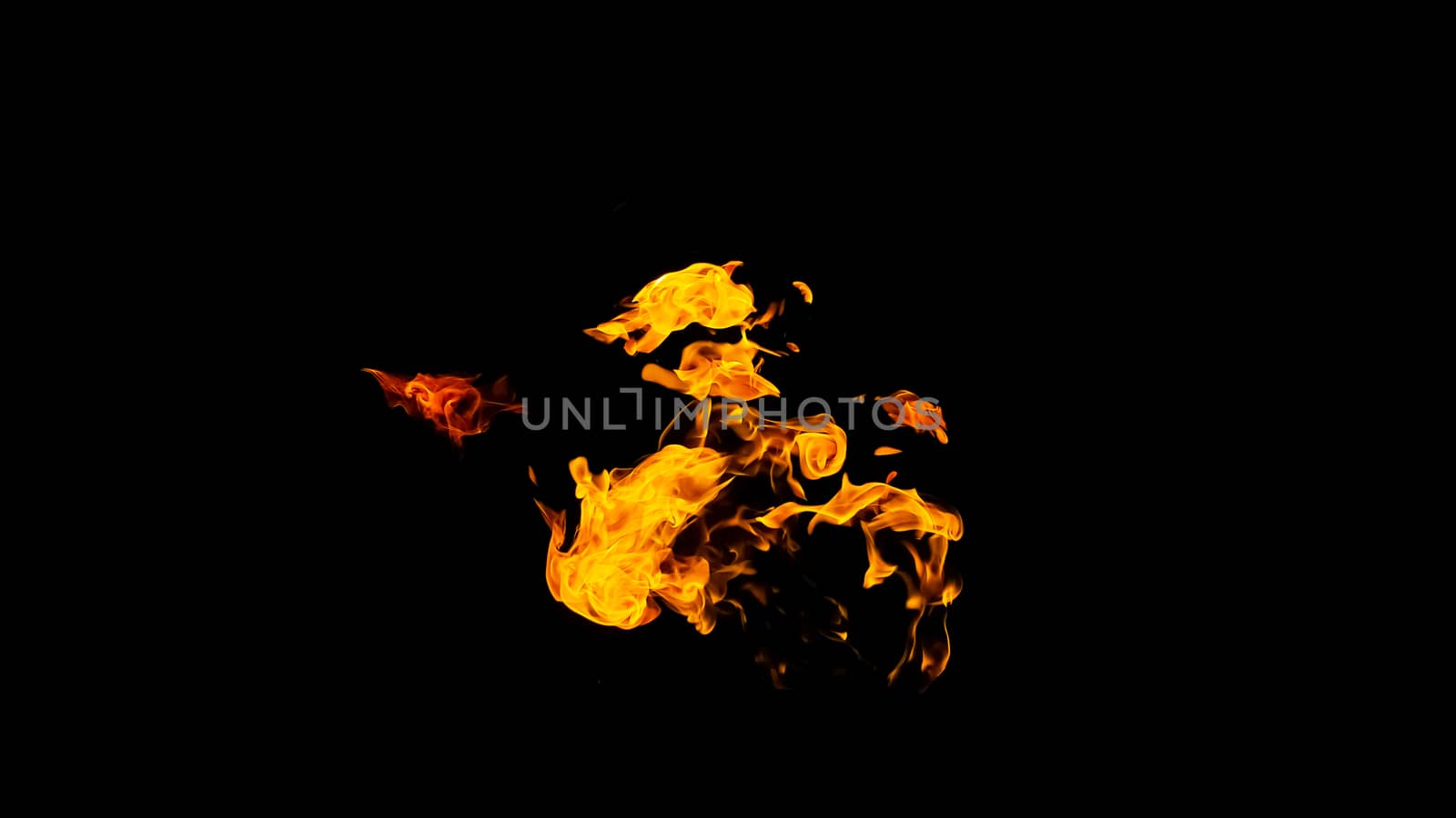 Fire flames on black background isolated. Burning gas or gasoline burns with fire and flames. Flaming burning sparks close-up, fire patterns. Infernal glow of fire in the dark with copy-space