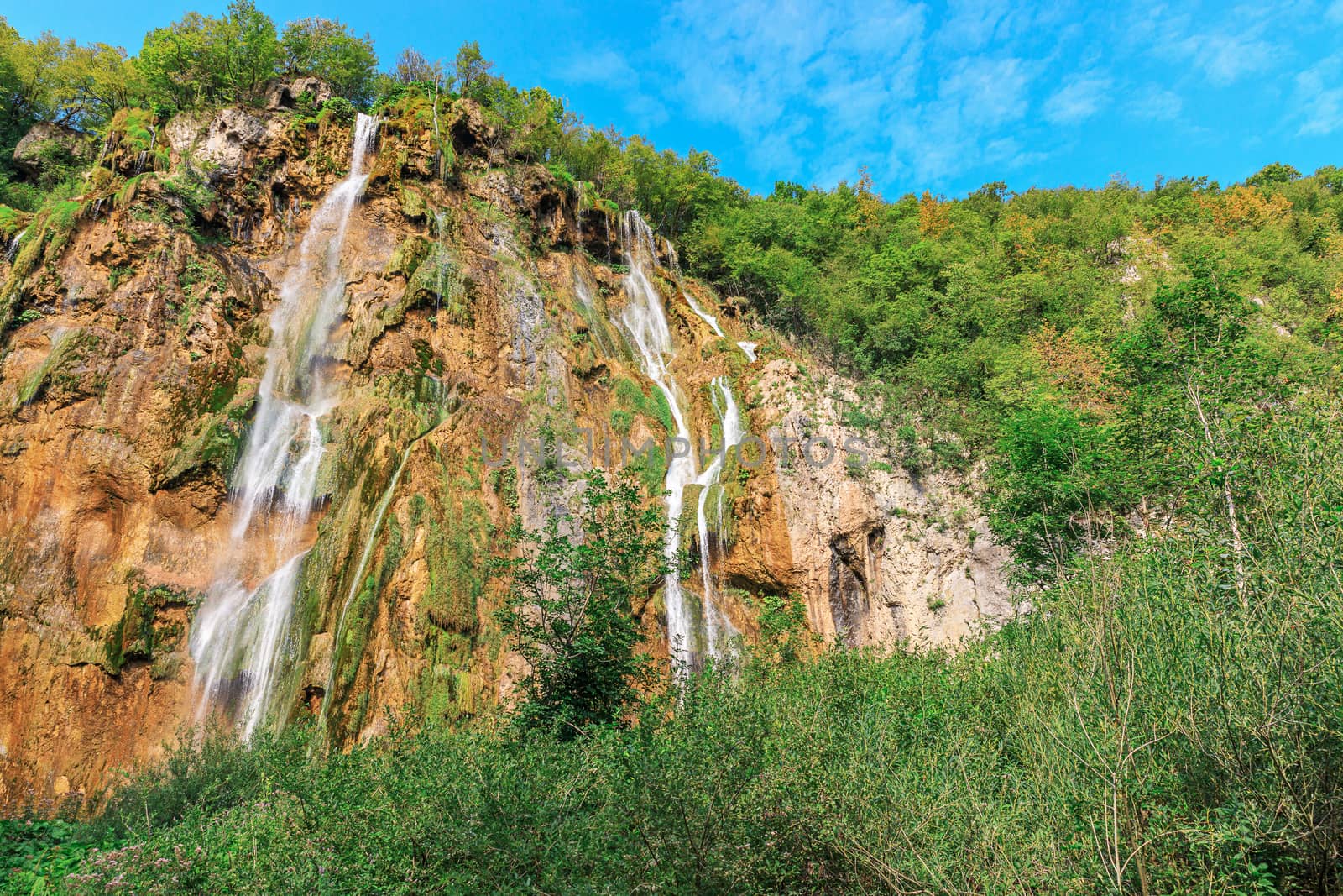 Landscape of waterfall among rocks in the forest. Plitvice Lakes National Park, Croatia. Nacionalni park Plitvicka Jezera, UNESCO World Heritage. 