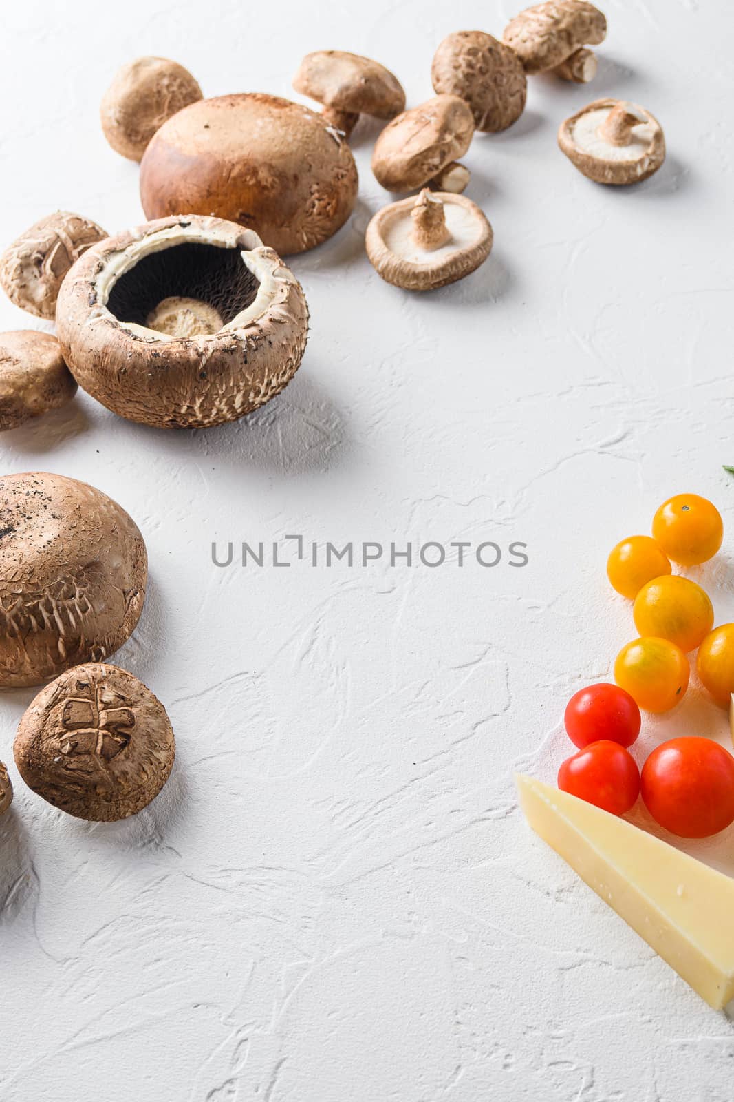 Portobello and ingredients for baking cheddar cheese, cherry tomatoes and sage on white background top view concept framed space for text. by Ilianesolenyi