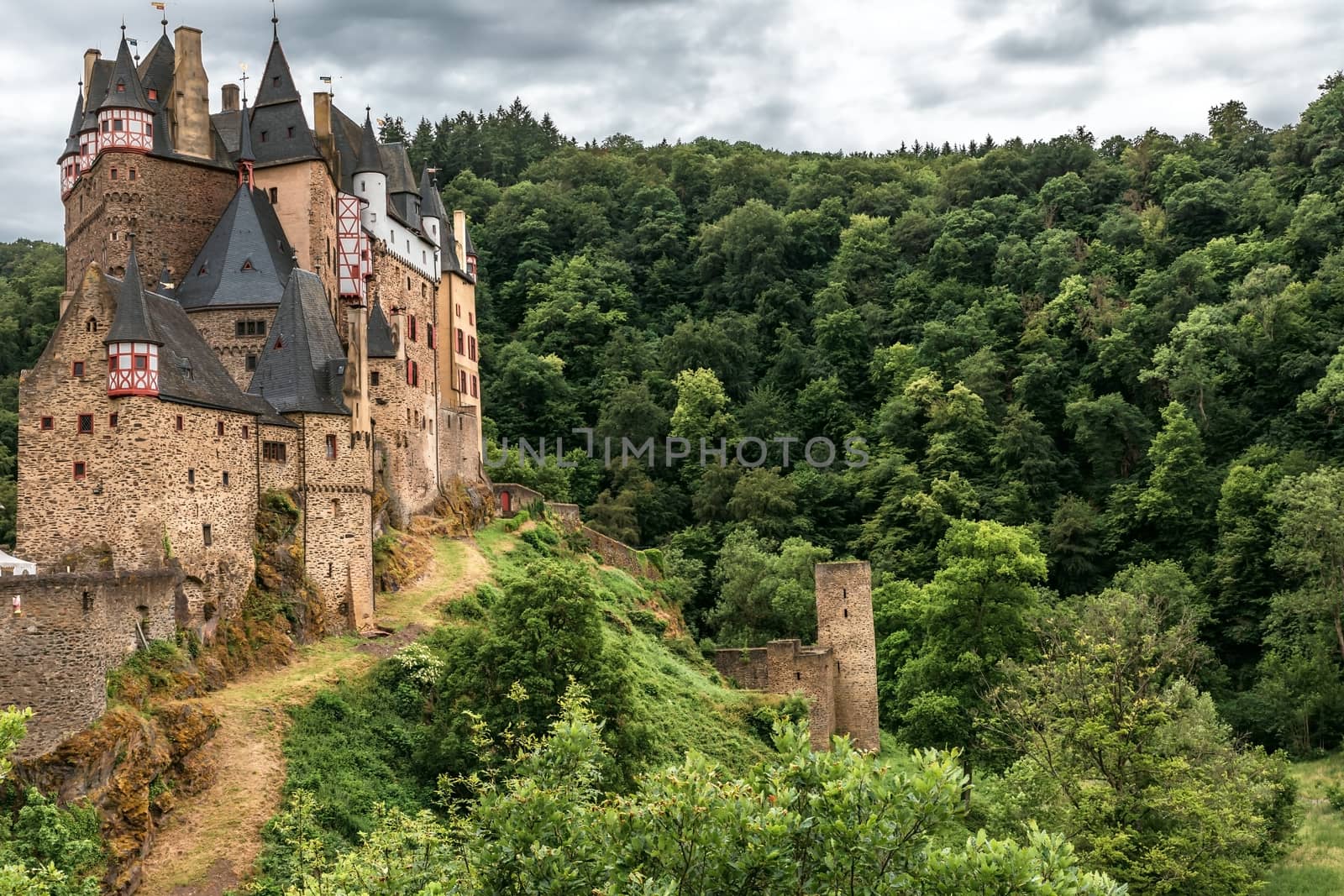 fairytale castle Eltz on the Moselle, Germany, with dramatic sky



