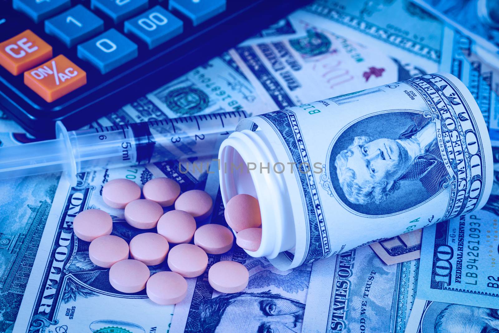 Medicine pills and black calculator with dollars. Pharmacy prescription for health. Concept of cost of the healthy life.