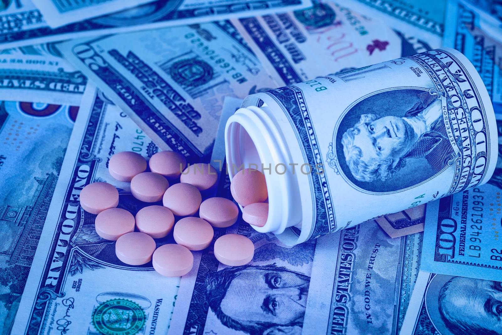 Medicine pills or capsules with dollars concept. by Eugene_Yemelyanov