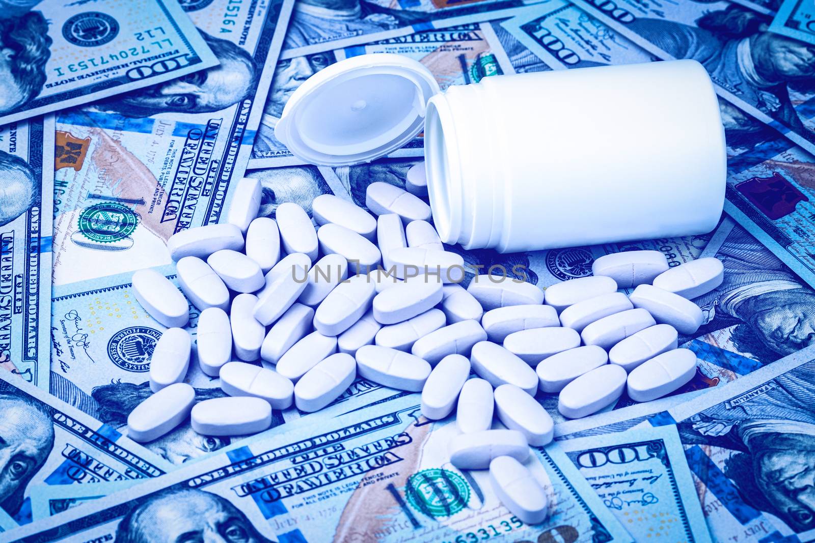 Pills on the background of hundred-dollar bills. The concept of  by Eugene_Yemelyanov