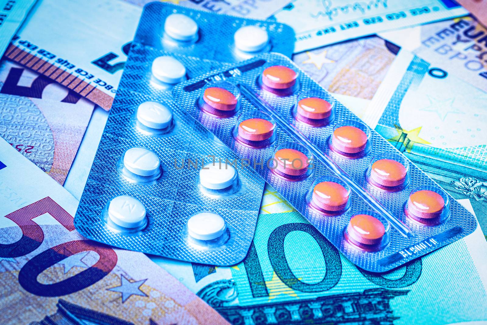Plate with pills on the background of euro bills. The concept of the expensive cost of healthcare or financing medicine.