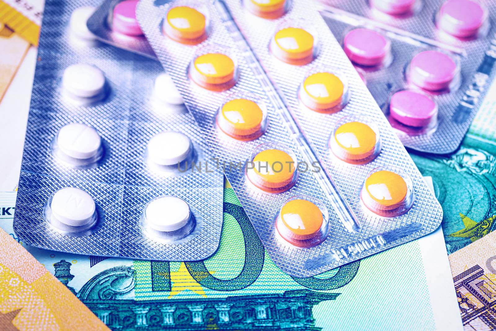 Plate with pills on the background of euro bills. The concept of the expensive cost of healthcare or financing medicine.