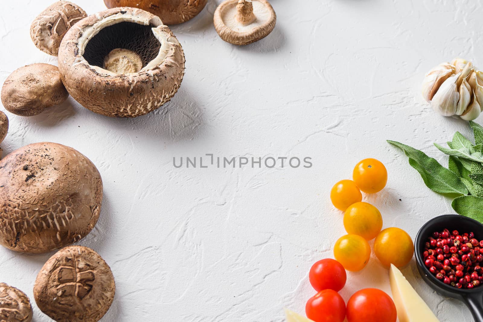 Mushrooms ingredients for baking portobello, cheddar cheese, cherry tomatoes and sage on white background side view concept framed space for text. by Ilianesolenyi