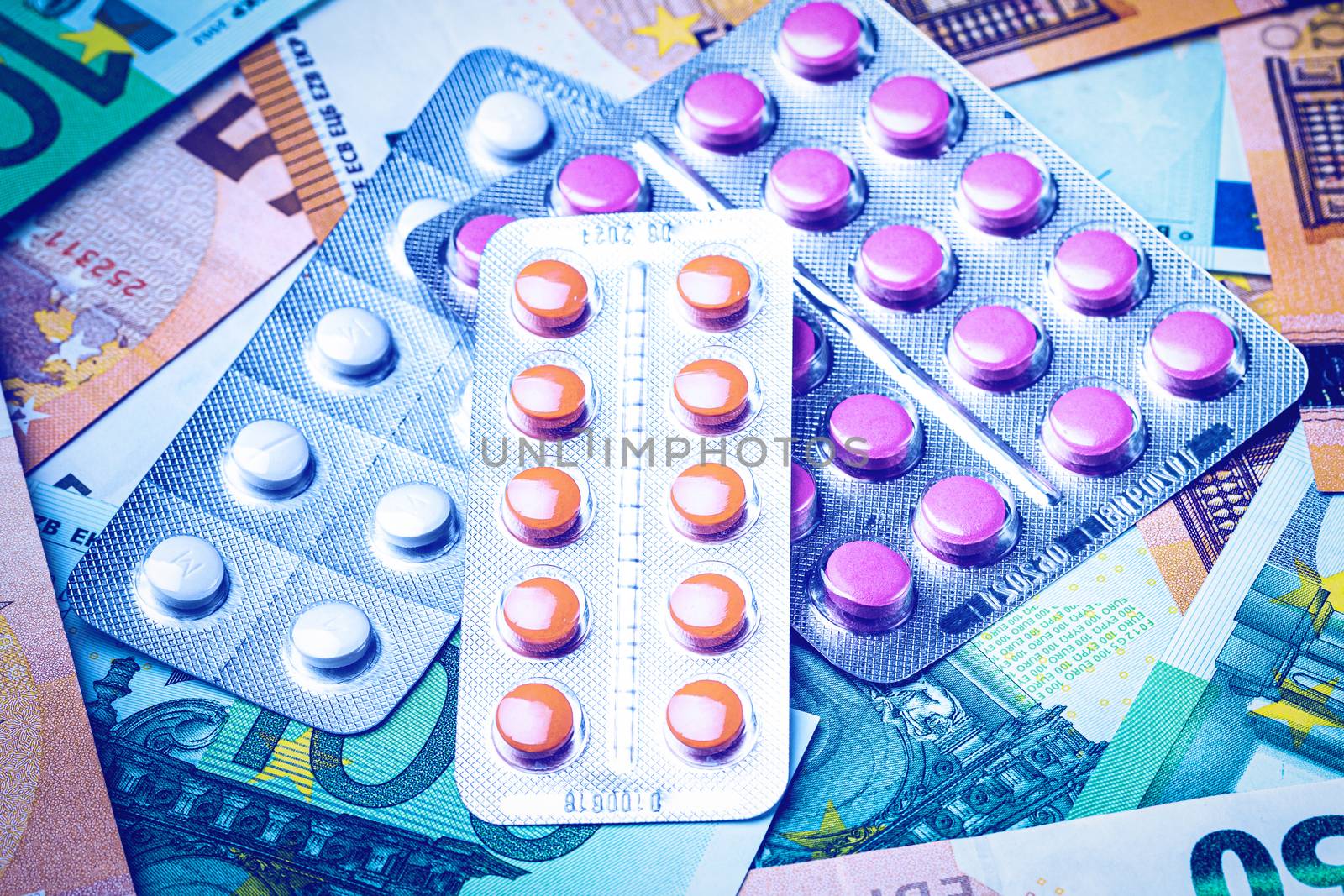 Plate with pills on the background of euro bills. The concept of by Eugene_Yemelyanov