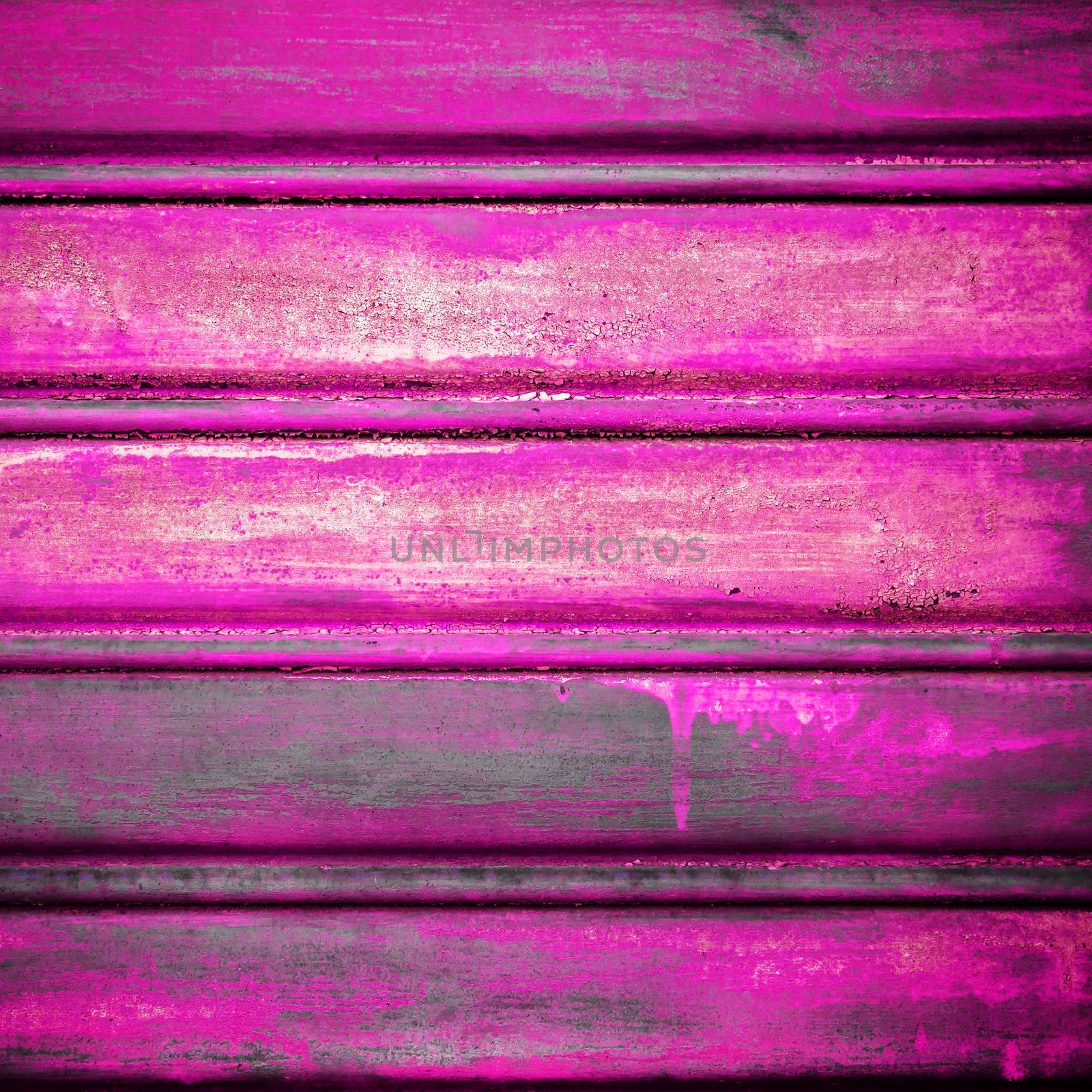 Close-up metallic pattern of rusty pink gate