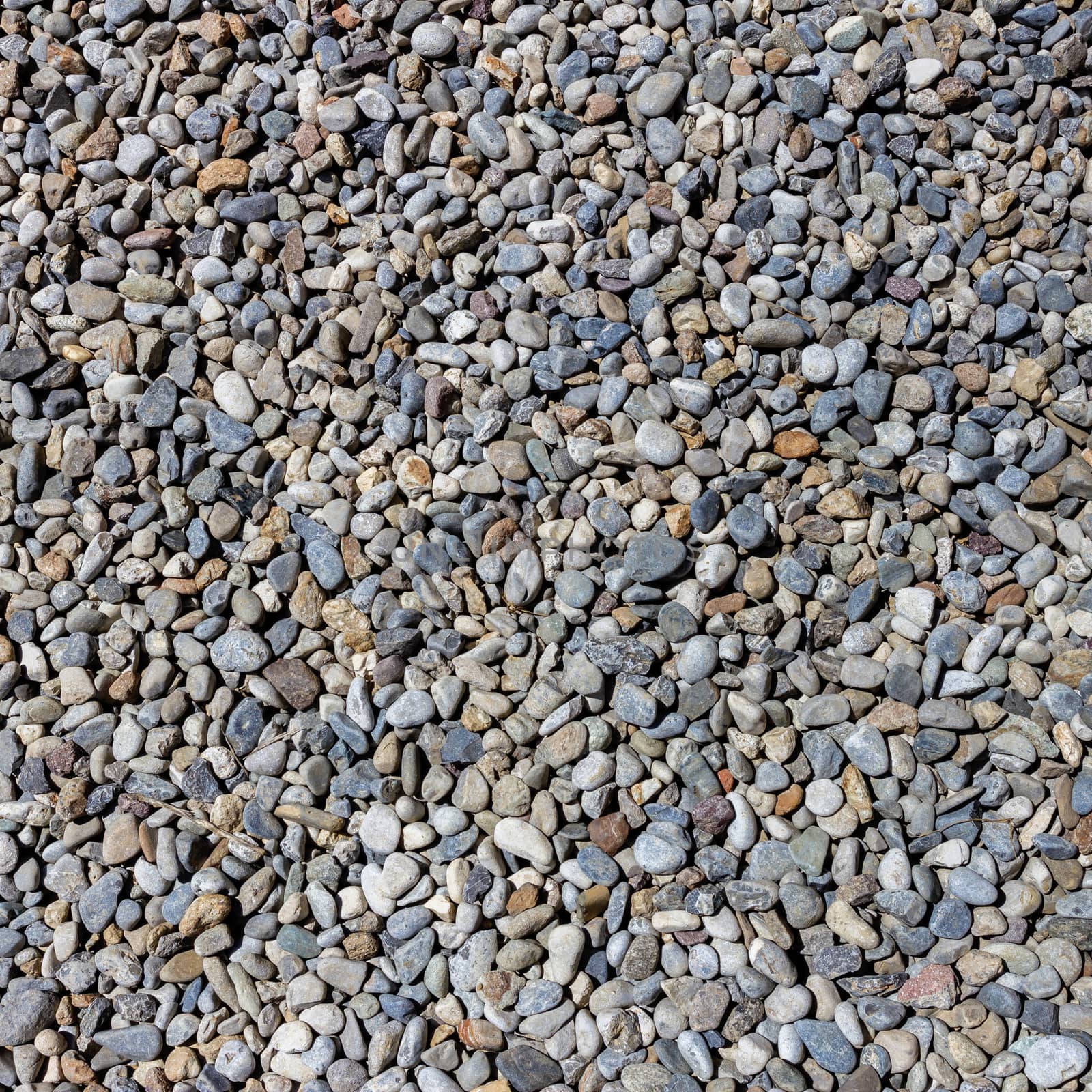 Small stones gravel texture. Naturally pebble textured background.