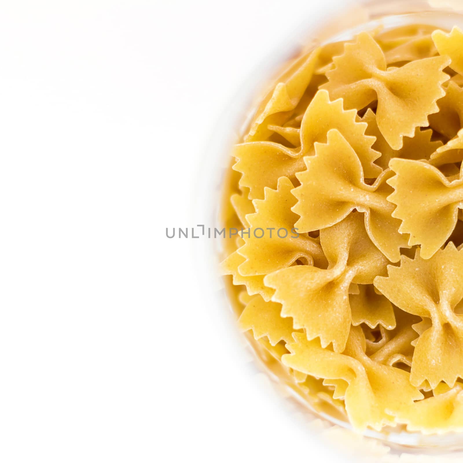 Farfalle pasta isolated on white background. Top view