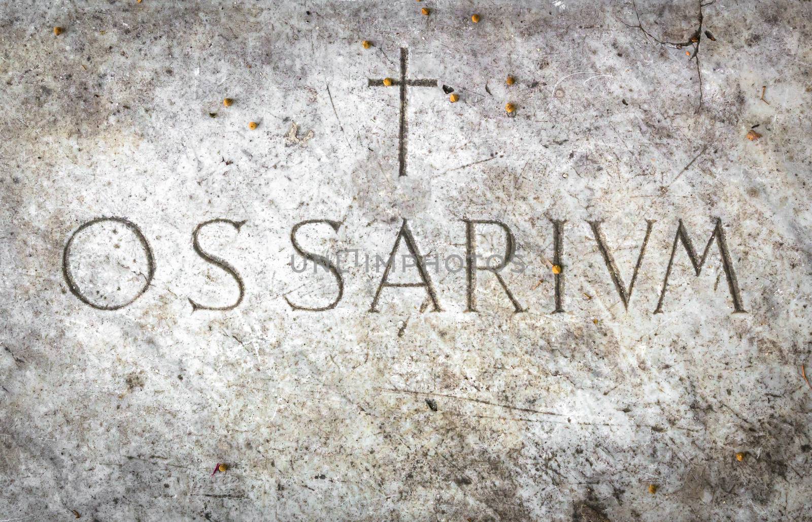 ossuary cemetery with the engraving in Latin "Ossarium" (translation from Latin Ossario).