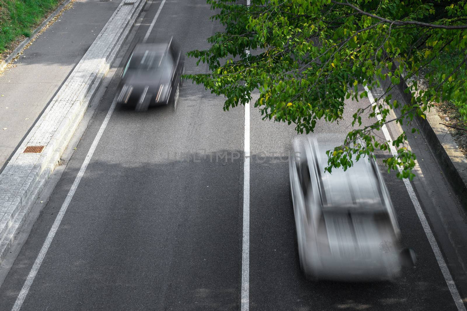 Motion blur of cars over the road by germanopoli