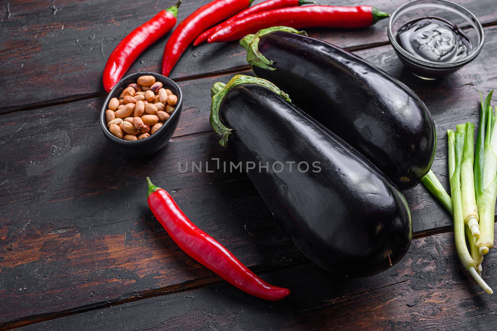 Sticky teriyaki aubergine ingredients, for cooking or grill chili pepper, eggplant, sauce, nuts side view