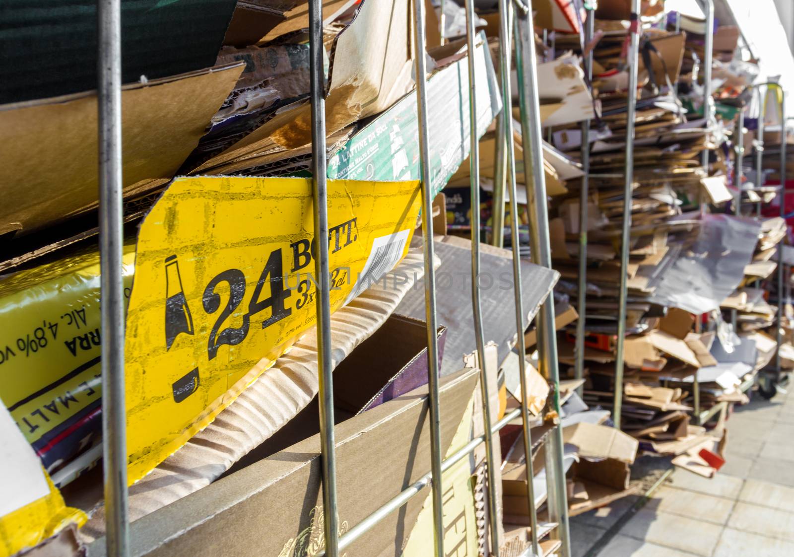 Stacks of paper and cardboard ready to be recycled. Urban recycling. Shallow depth of field.