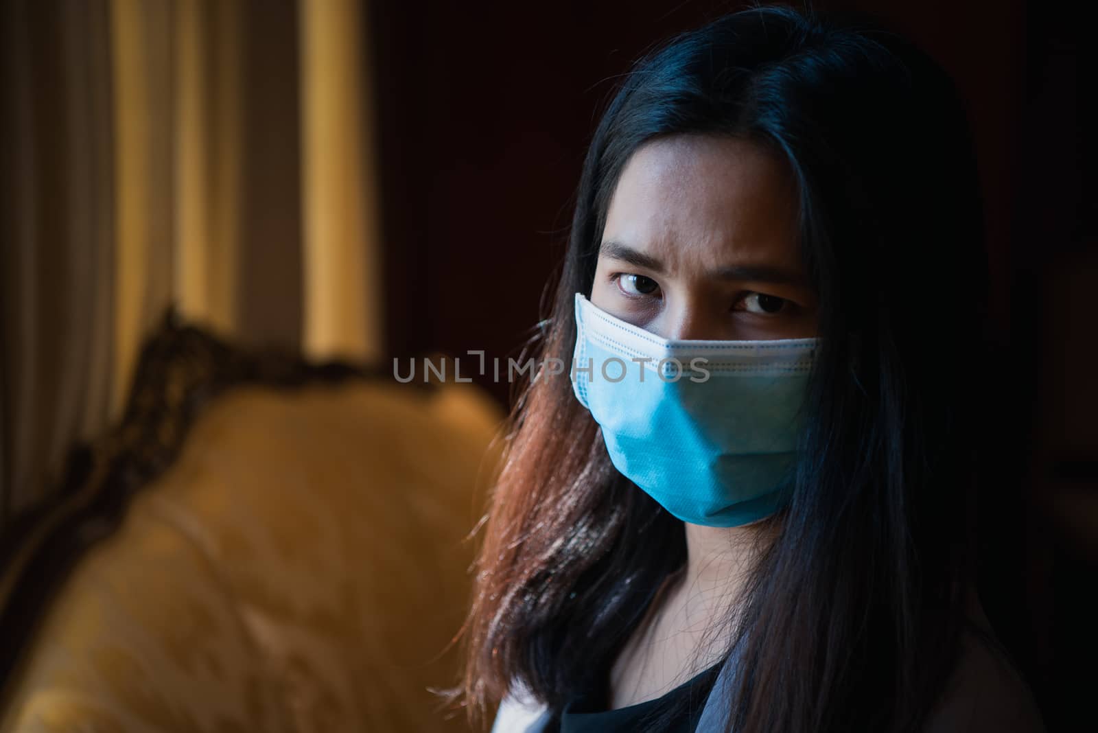 Asian pretty woman wearing mask respiratory protection mask against epidemic flu covid19 or corona virus influenza in office with fear emotion in concept illness, outbreak, healthcare in life