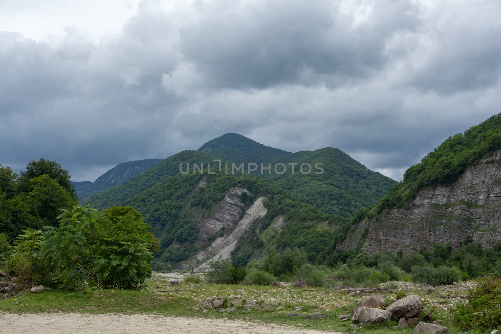 Ashe mountain river valley at the cloudy summer day