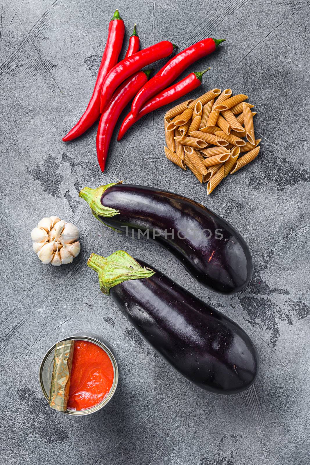 Aubergine penne arrabiata ingredients, top view.