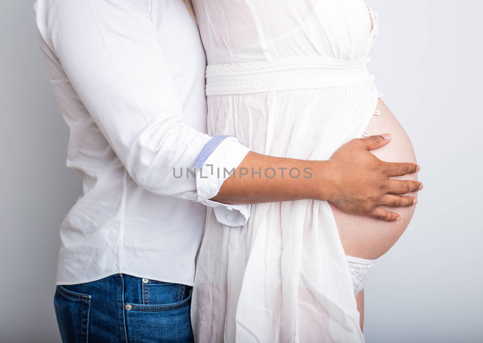 pregnant couple in love with baby belly. Hands on stomach baby bump. husband hand pregnant belly
