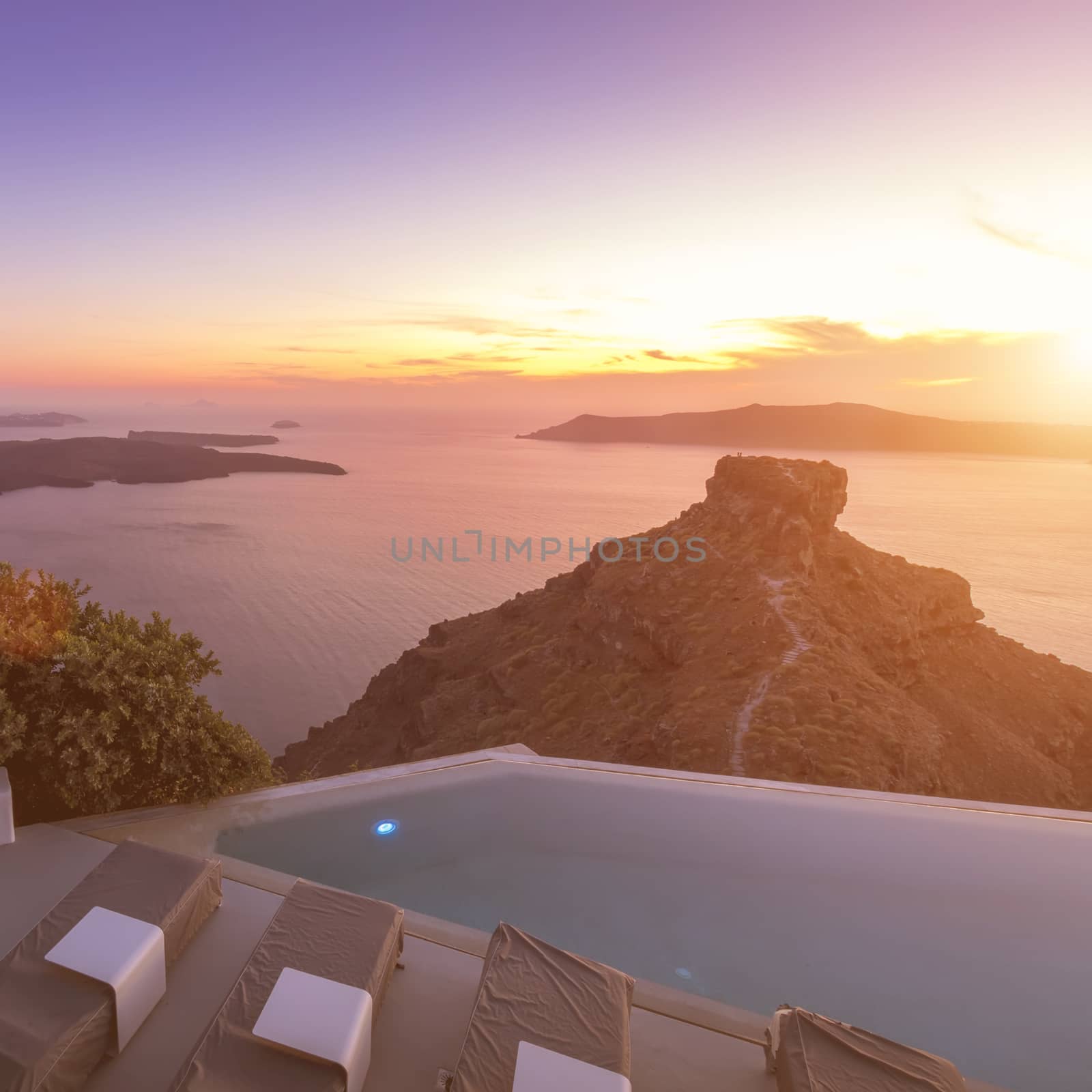 Seascape of sunset overlooking the caldera and the sea in the village of Imerovigli on the island of Santorini in the summer. Greece. 